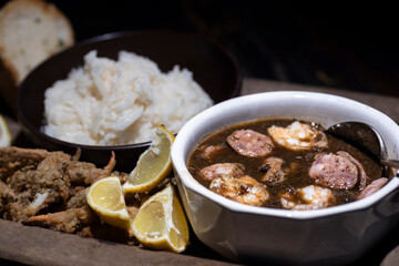 Seafood gumbo with rice and crab fingers.