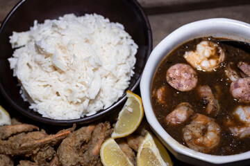 Seafood gumbo with rice and crab fingers.