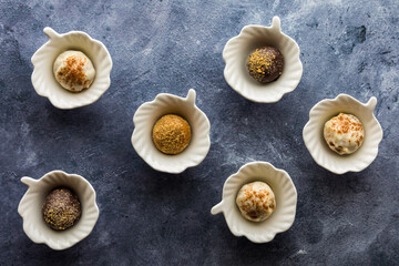 small leaf shape dishes containing sweet pumpkin spice truffles. 