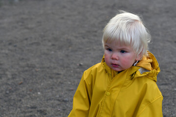 Outdoor Portrait of a cute little blond boy