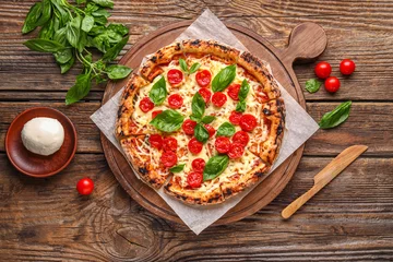 Foto op Aluminium Board with tasty pizza Margarita, fresh tomatoes and Mozzarella cheese on wooden background © Pixel-Shot