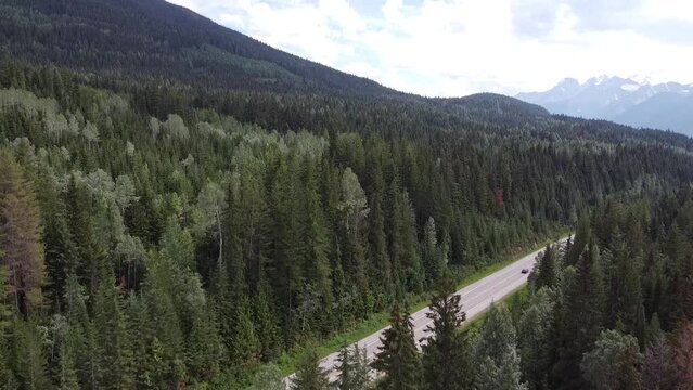 Drone Aerial Horizontal Down Nature Shot of Highway and Trees in British Columbia Beaver Canada
Shows: Forest, Trees, Highway, Cars Driving | Horizontal Shot with Down Motion - cars driving on Highway