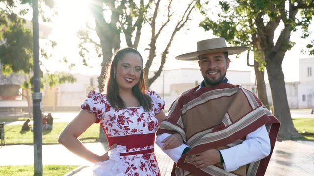 portrait couple dressed in traditional huaso clothes to dance cueca
