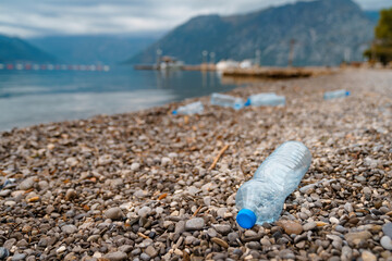 Fototapeta na wymiar Plastic bottles on the beach coast.
