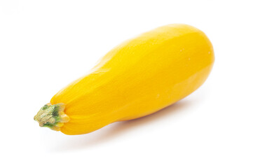 Yellow zucchini close up on a white background