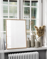 Frame Mockup in Modern Interior Room, Poster in front of window, 3d illustration.