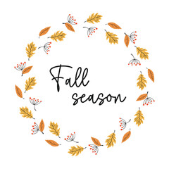 Vector fall wreath with orange and yellow leaves and rowan berries. Fall plant elements and slogan Fall season. Circle frame made from hand drawn botanical elements. 