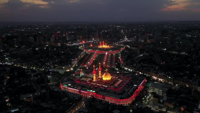 Imam Husayn and Al-Abbas ShrinA night shot by a drone of Shiite visitors and pilgrims at the mosque and shrine of Imam Hussein and Abbas in Karbala, Iraqe