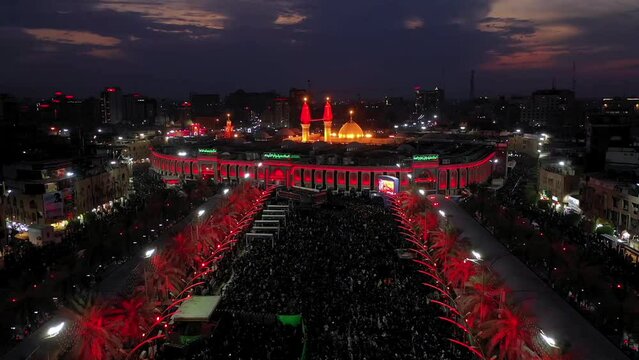 Imam Husayn and Al-Abbas ShrinA night shot by a drone of Shiite visitors and pilgrims at the mosque and shrine of Imam Hussein and Abbas in Karbala, Iraqe