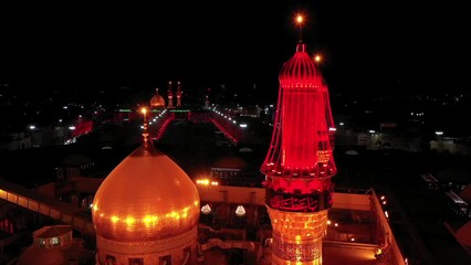Imam Husayn and Al-Abbas ShrinA night shot by a drone of Shiite visitors and pilgrims at the mosque and shrine of Imam Hussein and Abbas in Karbala, Iraqe