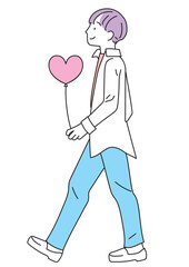 ハート形の風船を持った笑顔の男性