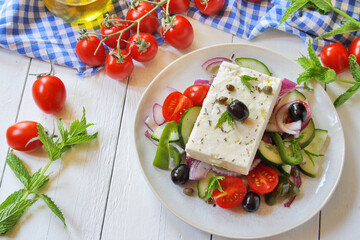 Traditional Greek salad (Horiatiki) with feta cheese and vegetables
