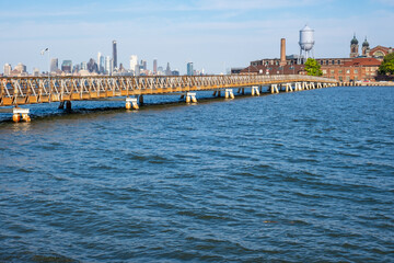 Ellis Island and Brooklyn skyline viewed from Liberty State Park in summer