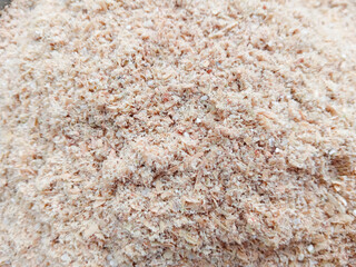 Paddy bran. Smooth rice husk background. Bekatul. Dedak. Rice bran. Close up