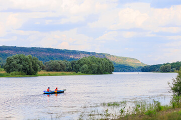 Fototapeta na wymiar People travel along the river in a kayak. Rafting as a healthy lifestyle. Background