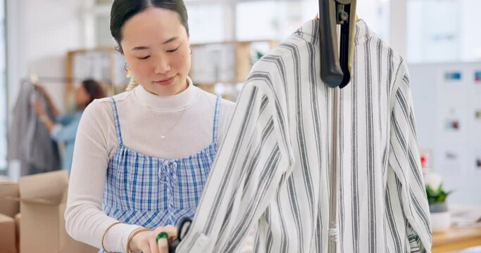 Asian woman, fashion designer and steam clothing in logistics, small business or quality service at boutique. Female person in dry cleaning, retail store or product preparation for delivery at shop