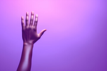 Obraz premium Person's hand reaching up into air. Suitable for concepts related to aspiration, achievement, help, support, and reaching for goals.