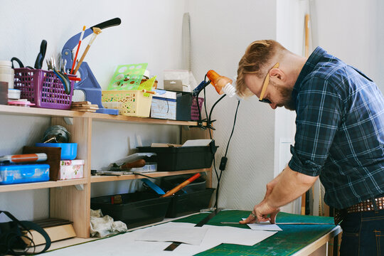 Professional leather craftsman at work