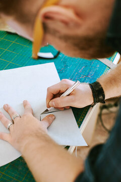 Craftsman cutting leather