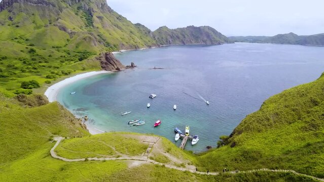 Aerial View Padar Island, Labuan Bajo, Indonesia. Capturing ocean and beautiful landscape of sky, hills and coastal beach.