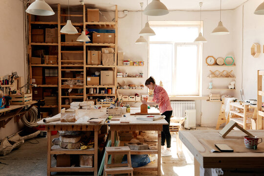Woman working in carpentry workshop
