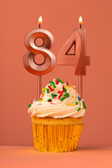 Birthday cake with candle number 84 - Coral fusion background
