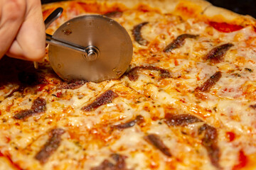 Traditional anchovy pizza (alicci) with artisan long-matured dough. "vera pizza" Neapolitan