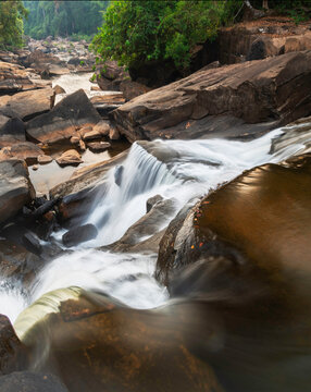 Maak Ngaew Waterfall and movement of flowing water cascades, at sunset, near Pakse,Laos.