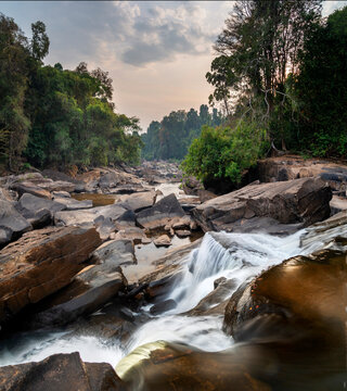 Maak Ngaew Waterfall and movement of flowing water cascades, at sunset, near Pakse,Laos.