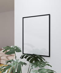 simple frame mockup poster hanging on the white wall from side view with plant decoration