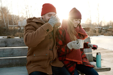Couple warming up outdoors