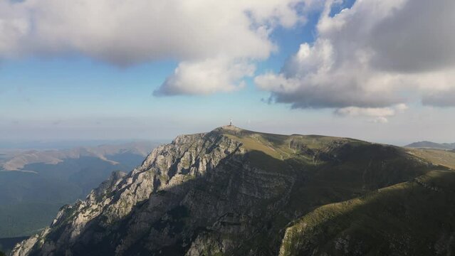 Aerial drone footage of Costila radio relay located on mountain peak Bucegi Natural Park. Beautiful mountain landscape. Bucegi Mountains, Romania
