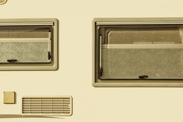 Details of camper, window with cover blind