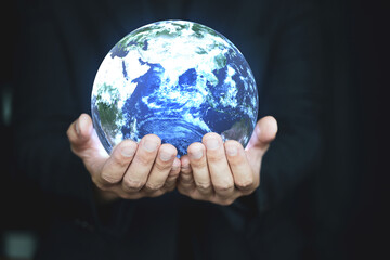 Hand holding earth, Concept safe earth