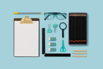 Stationary, school supplies  flat lay on blue background