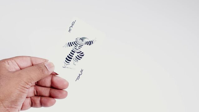 Hand Holds A joker card