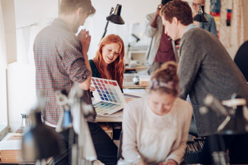 Young and diverse group of coworkers working in a startup company office together