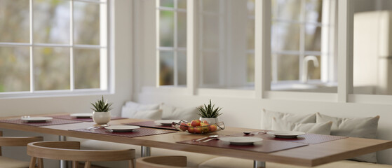 A dining table with a beautiful dining table settinga in a modern dining room.
