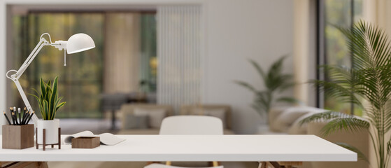 Copy space on a white table with a blurred modern living room in the background.