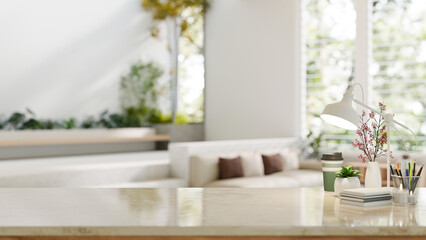 Copy space on a table with a blurred modern spacious white living room in the background.