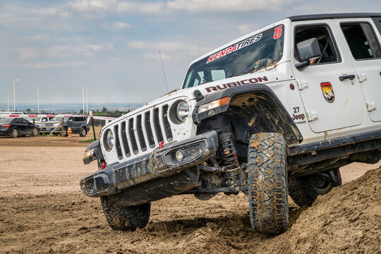 Loveland, CO, USA - August 26, 2023: Jeep Wrangler, Rubicon model, on a muddy training drive off-road course