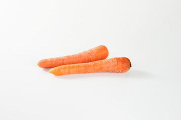 Photo of Fresh carrots isolated on white background.