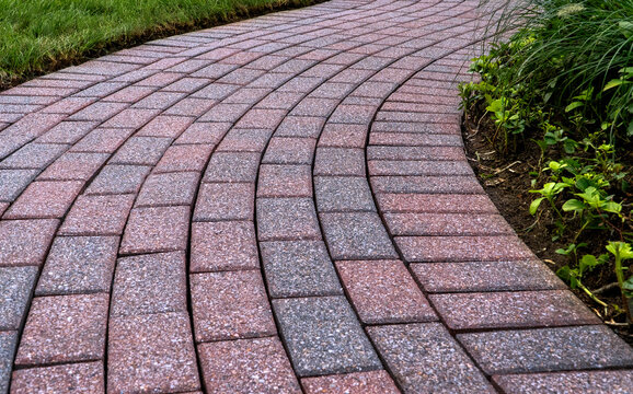 Brick pavers arranged in a curving pattern.
