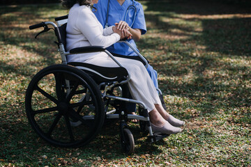 Fototapeta premium Asian young woman nurse at nursing home take care disabled senior man. Caregiver doctor serve physical therapy for older elderly patient to exercise and practice walking on walker or cane at backyard.
