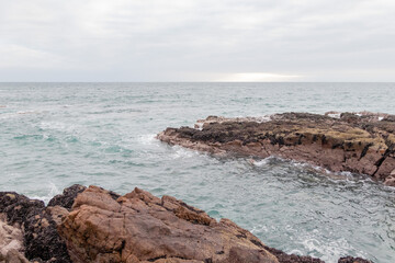 waves crashing on the rocks of the south coast of Arica