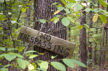 No trespassing Sign in the Woods - obrazy, fototapety, plakaty
