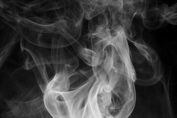 creative photo of white smoke on black background