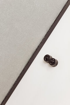 Abstract piece of interior with black knobs on wall