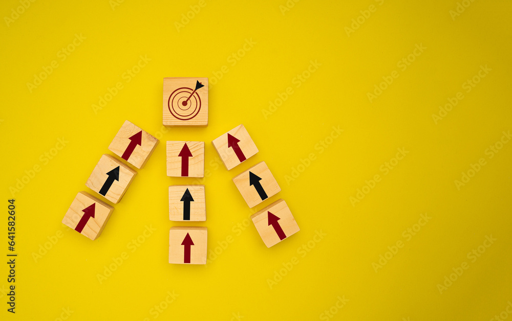 Poster wooden cubes with red and black arrows pointing to the dartboard icon are on a yellow background