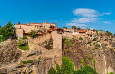Fototapeta na wymiar Monastery built on one of the peaks of Meteora. View of Holy Monastery of Transfiguration of Jesus. Landscape of the Thessaly Valley, Greece.